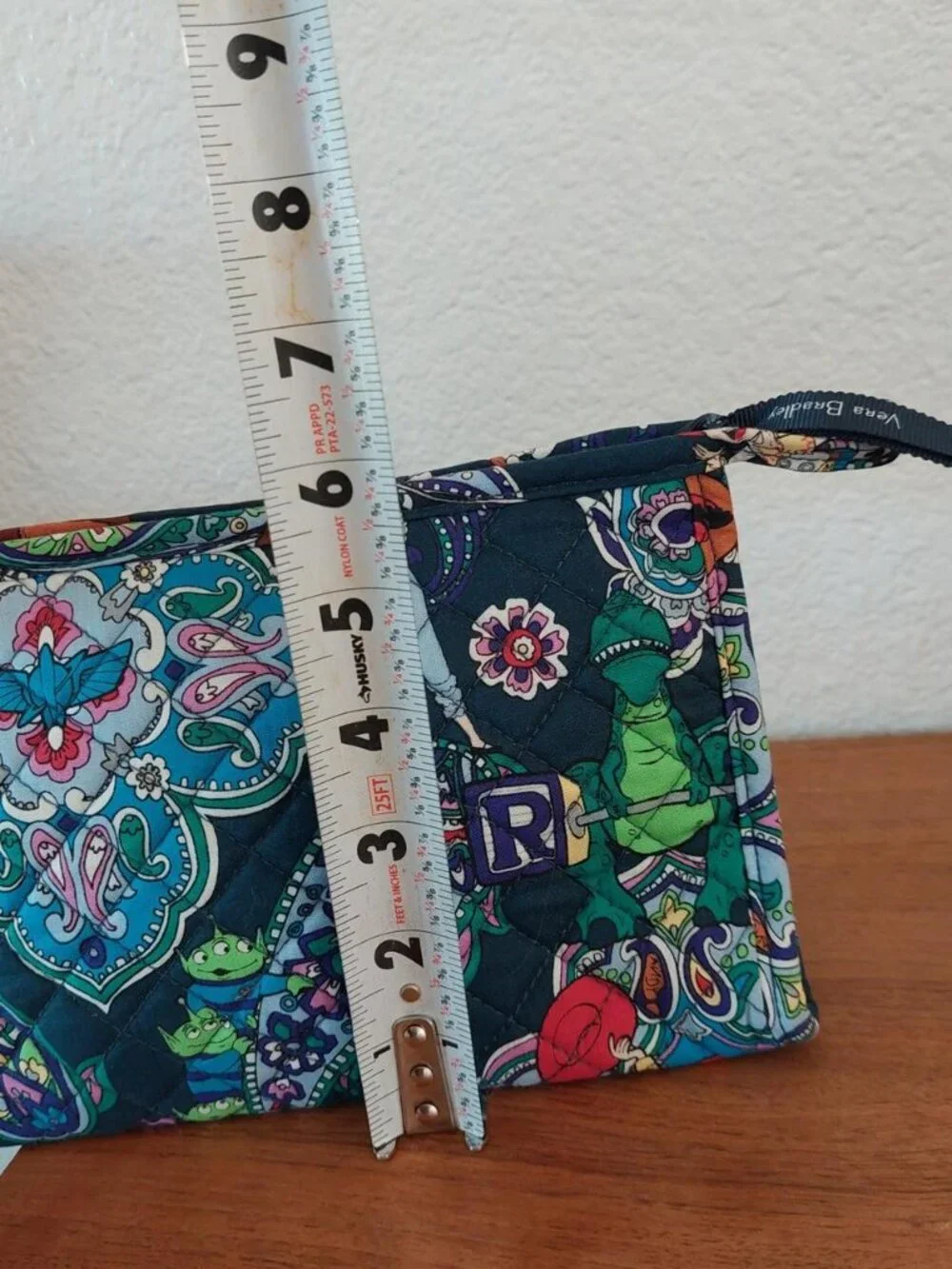 vera bradley Disney Pixar Toy Story quilted pouch with green dinosaur graphic an